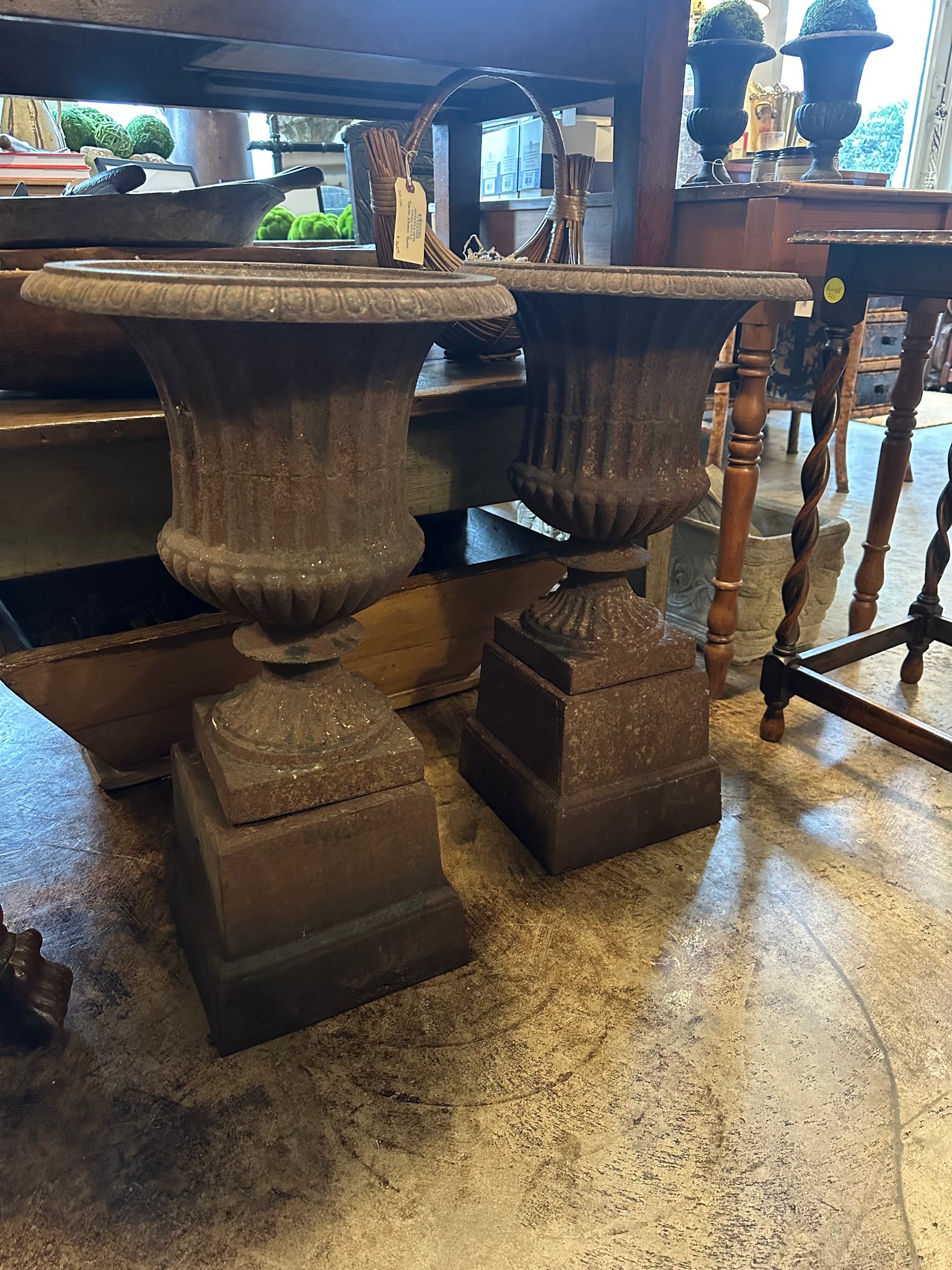 Pair of Cast Iron Urns on Plinths